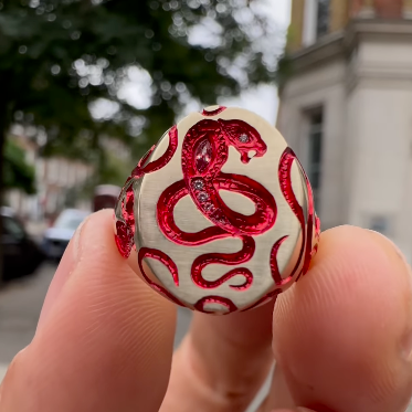 Castro Smith - engraved snake signet ring with red plating and diamonds