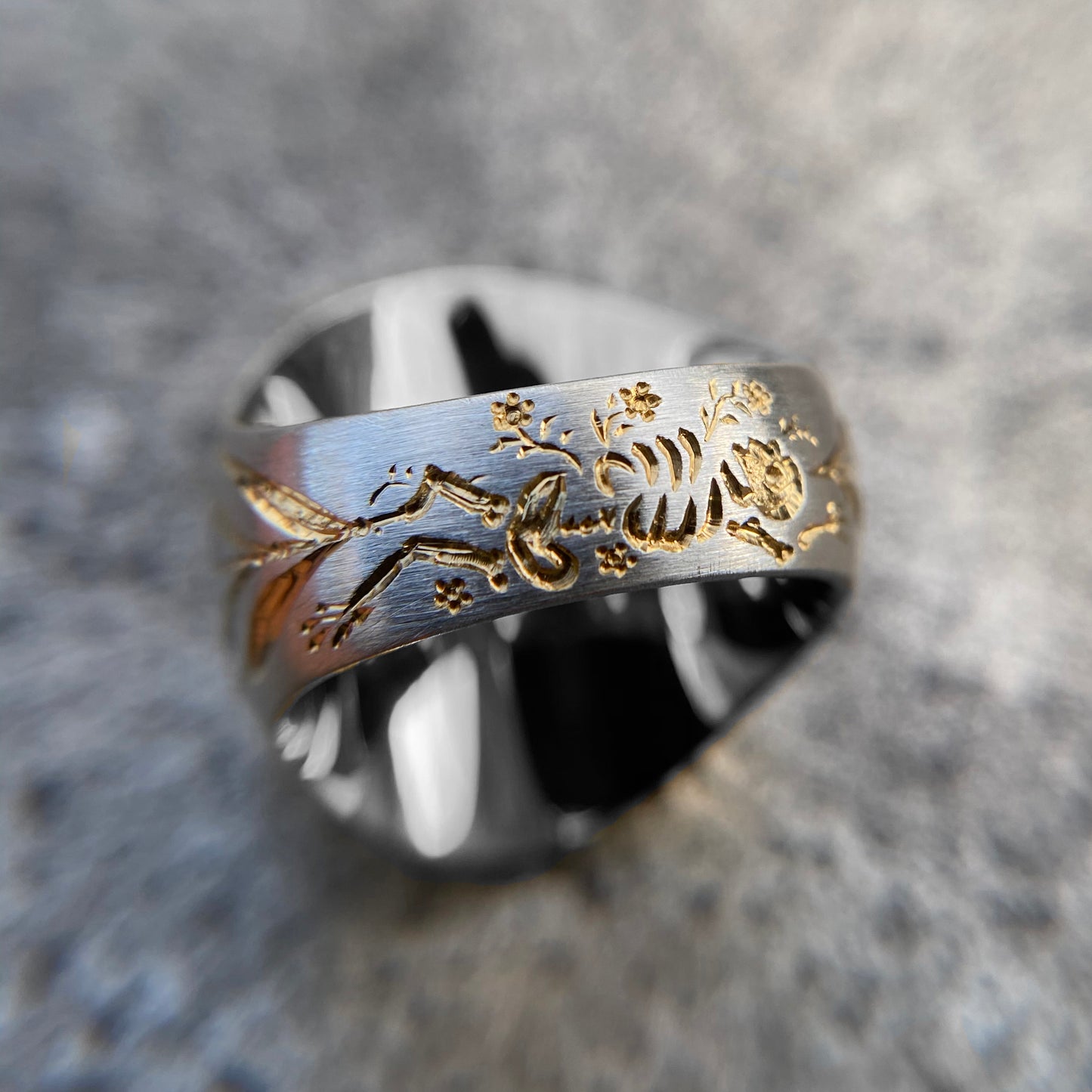 Castro Smith - Hand engraved signet ring with a sunflower on the face of the ring and corn details on the sides and skeleton at the bottom of the band. 