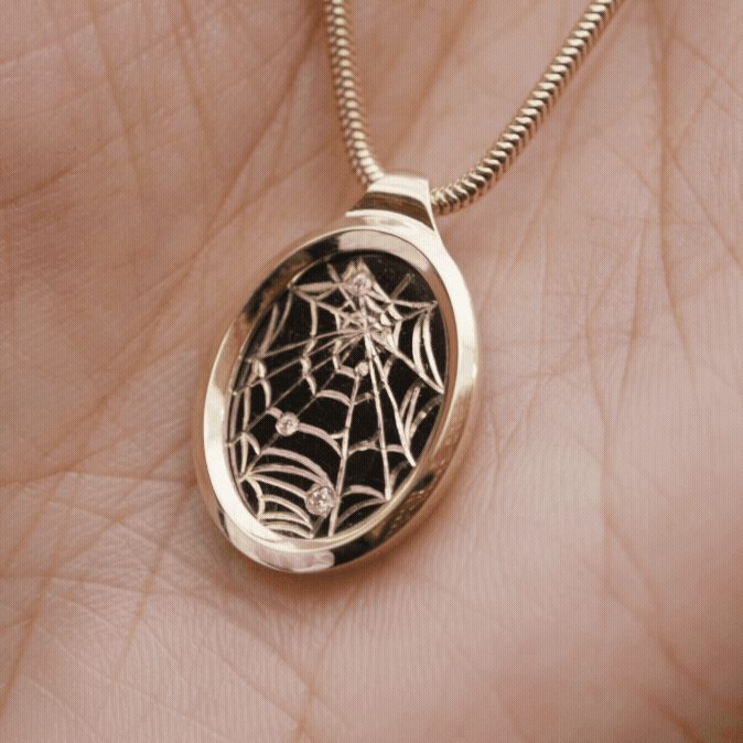 Handcrafted 9ct yellow gold necklaces with unique charms, showcasing individual artistry and elegance.