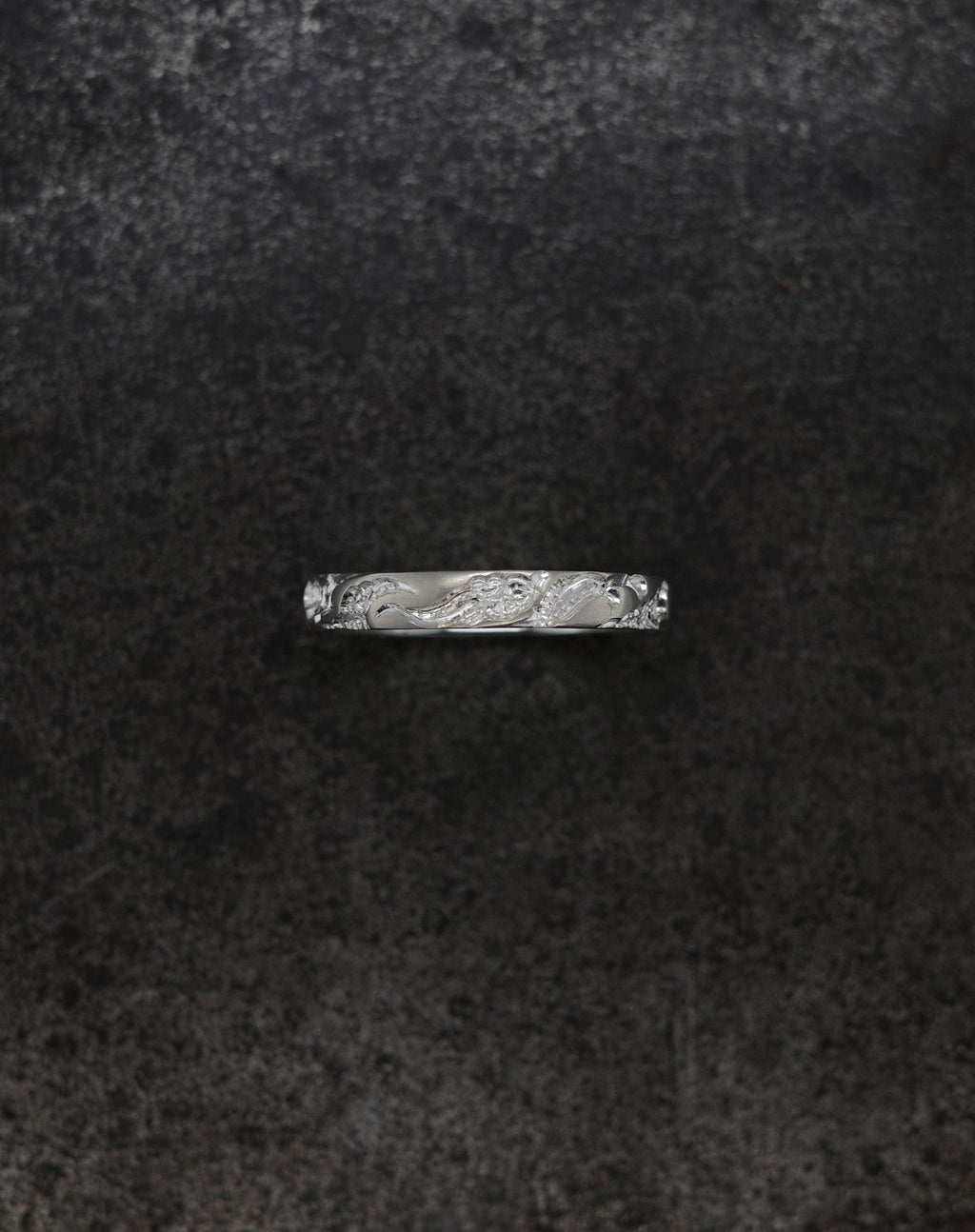 Wave Band (4mm) silver ring with intricate design on a dark background.