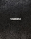 Wave Band (4mm) silver ring with intricate design on a dark background.