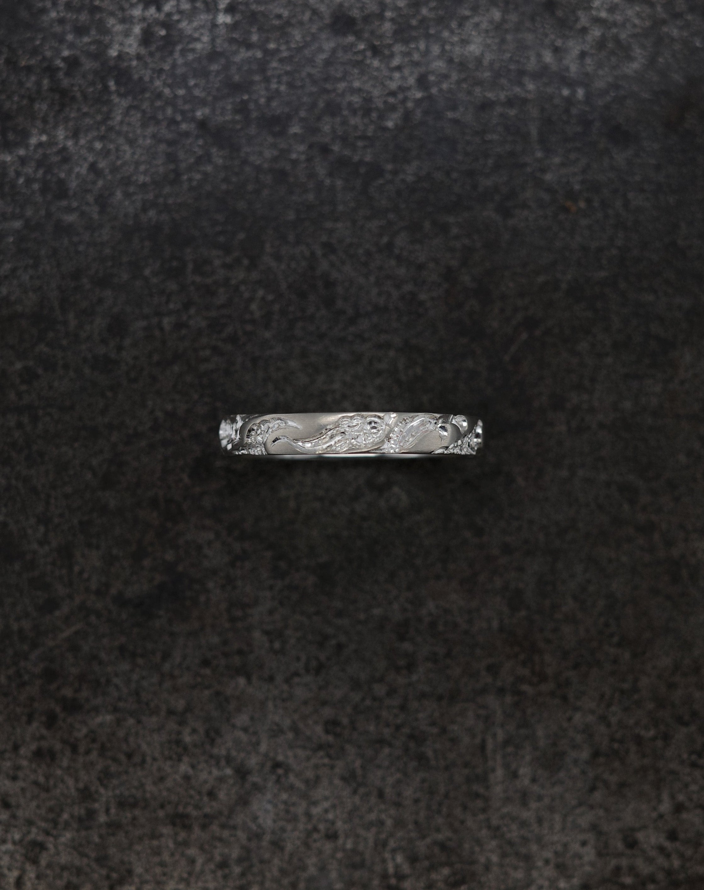 Wave Band (4mm) silver ring with intricate design on a dark background.