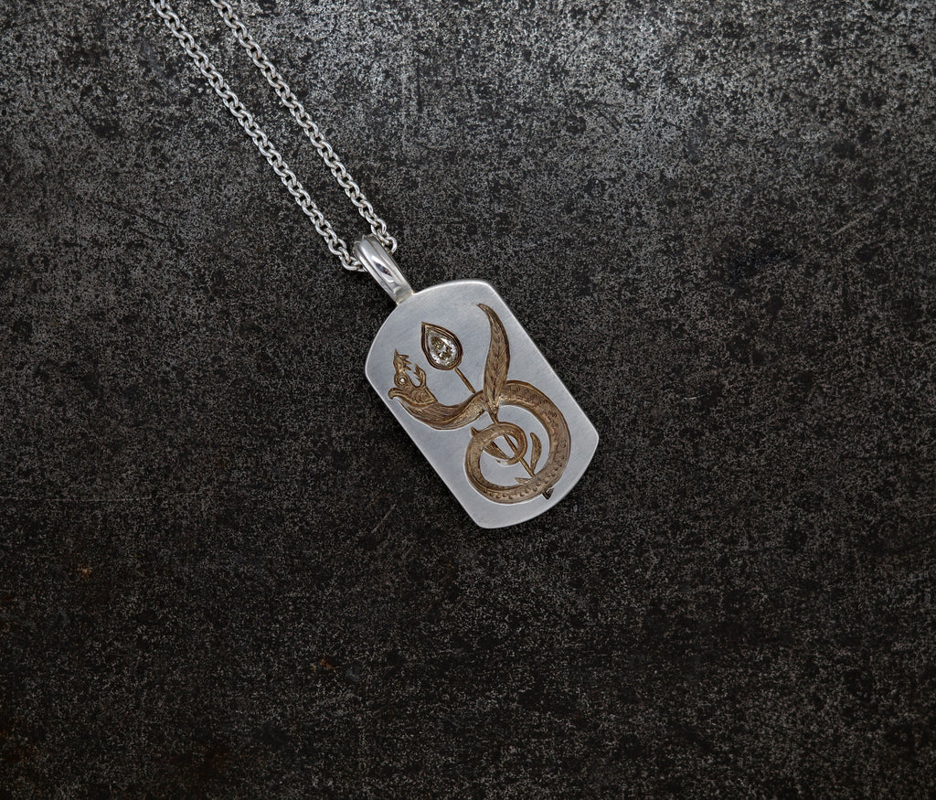 Silver Apple Core pendant necklace featuring a cognac diamond-seeded apple core with a diamond-tipped design on chain