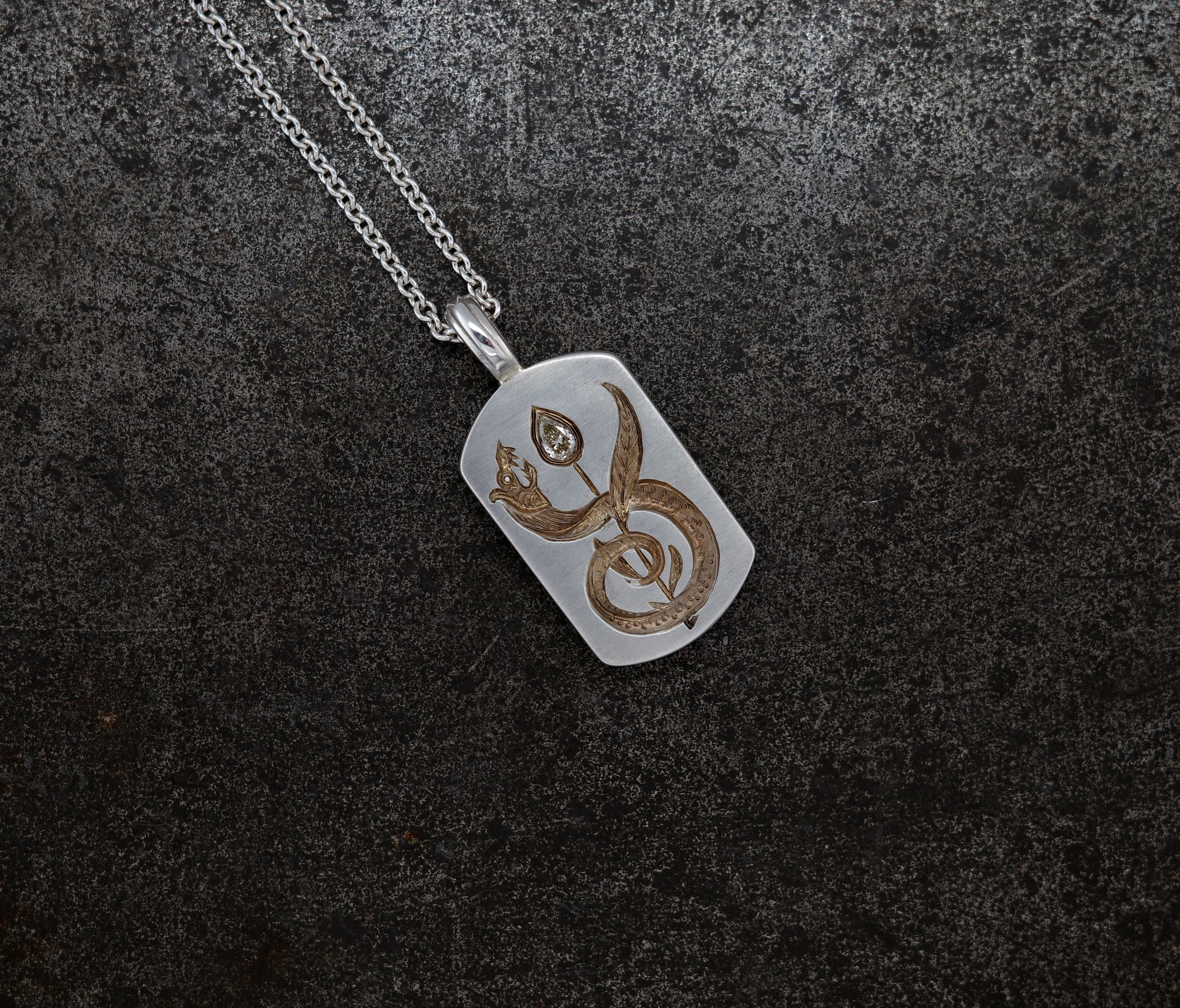 Silver Apple Core pendant necklace featuring a cognac diamond-seeded apple core with a diamond-tipped design on chain