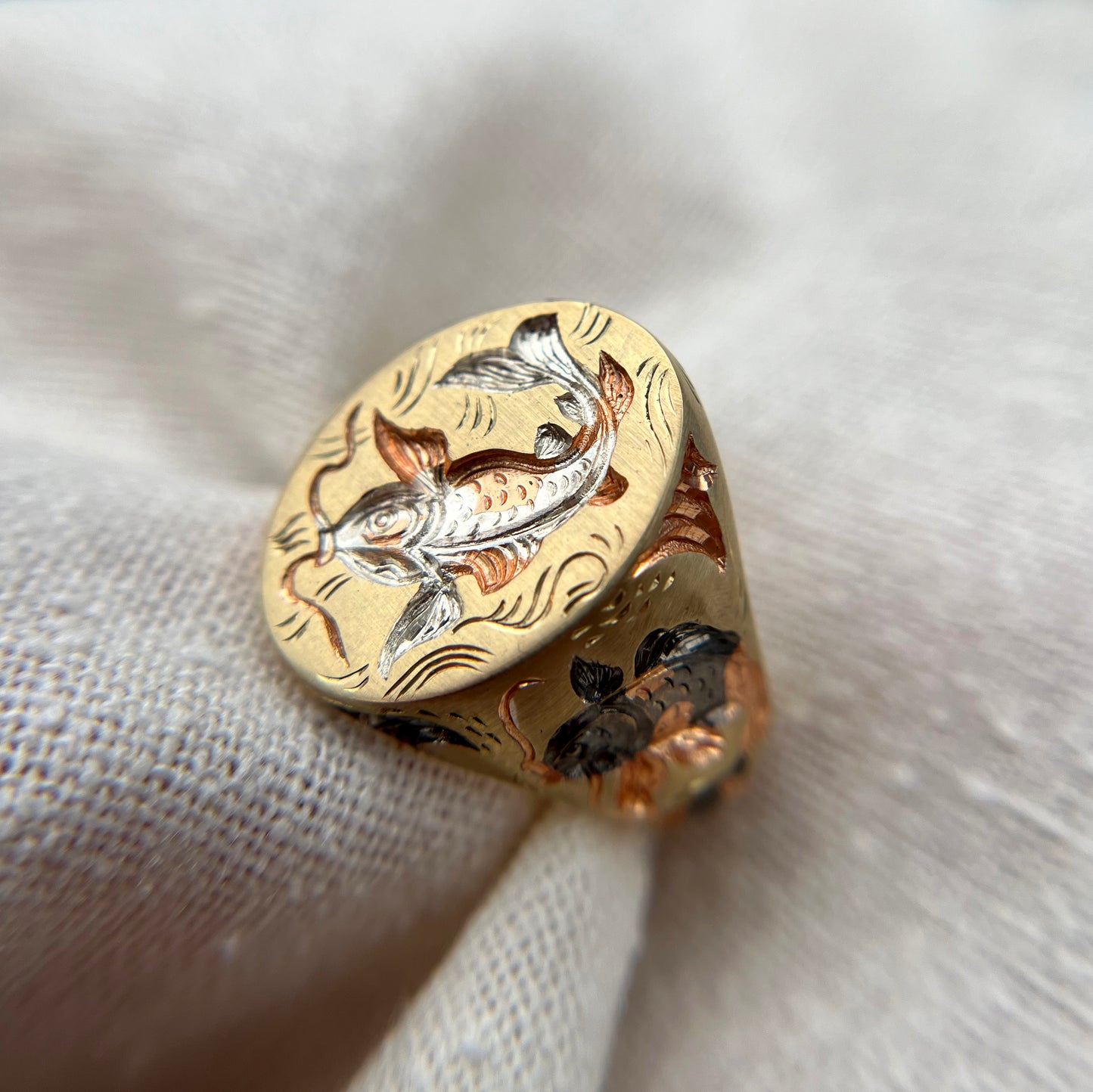 Castro Smith Gold Signet Ring. Carp Signet ring with e=hand engraved carps throughout the ring. The ring has wave and water engraved details. 