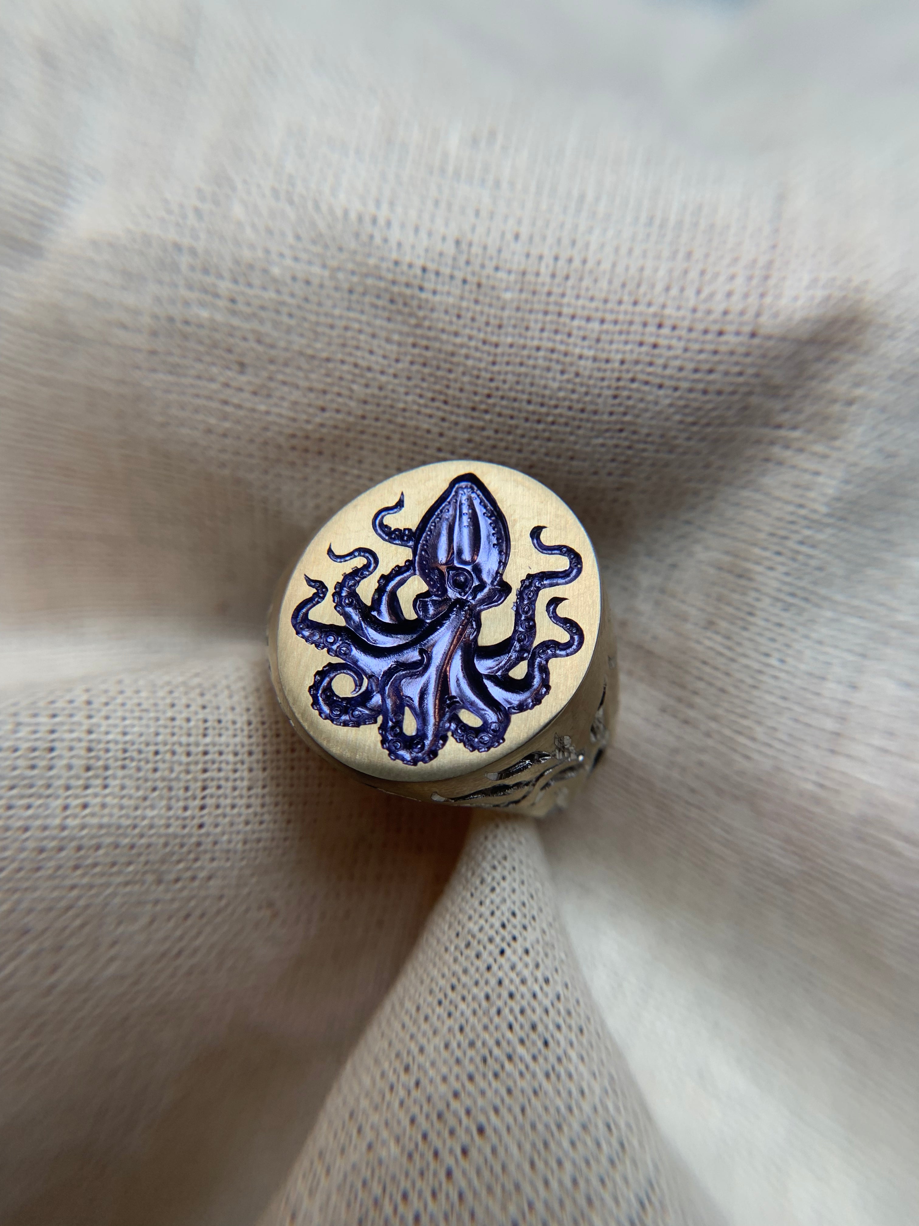 Gold ring with Octopus engraved on the face