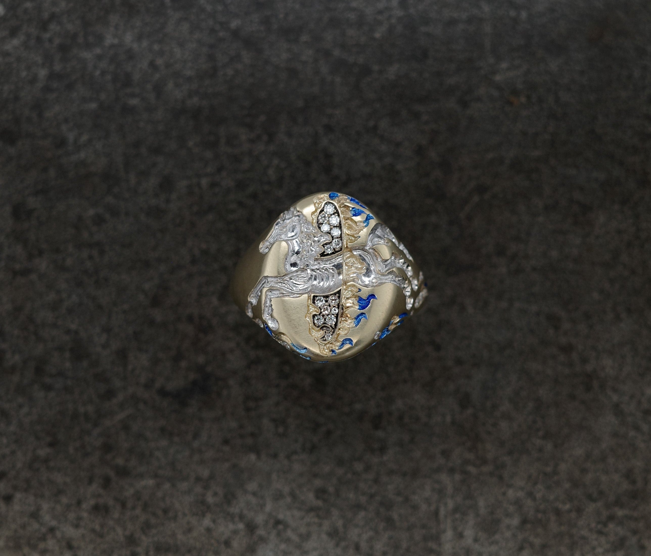 Fire Horse Ring featuring intricate design and vibrant colors on a dark background.