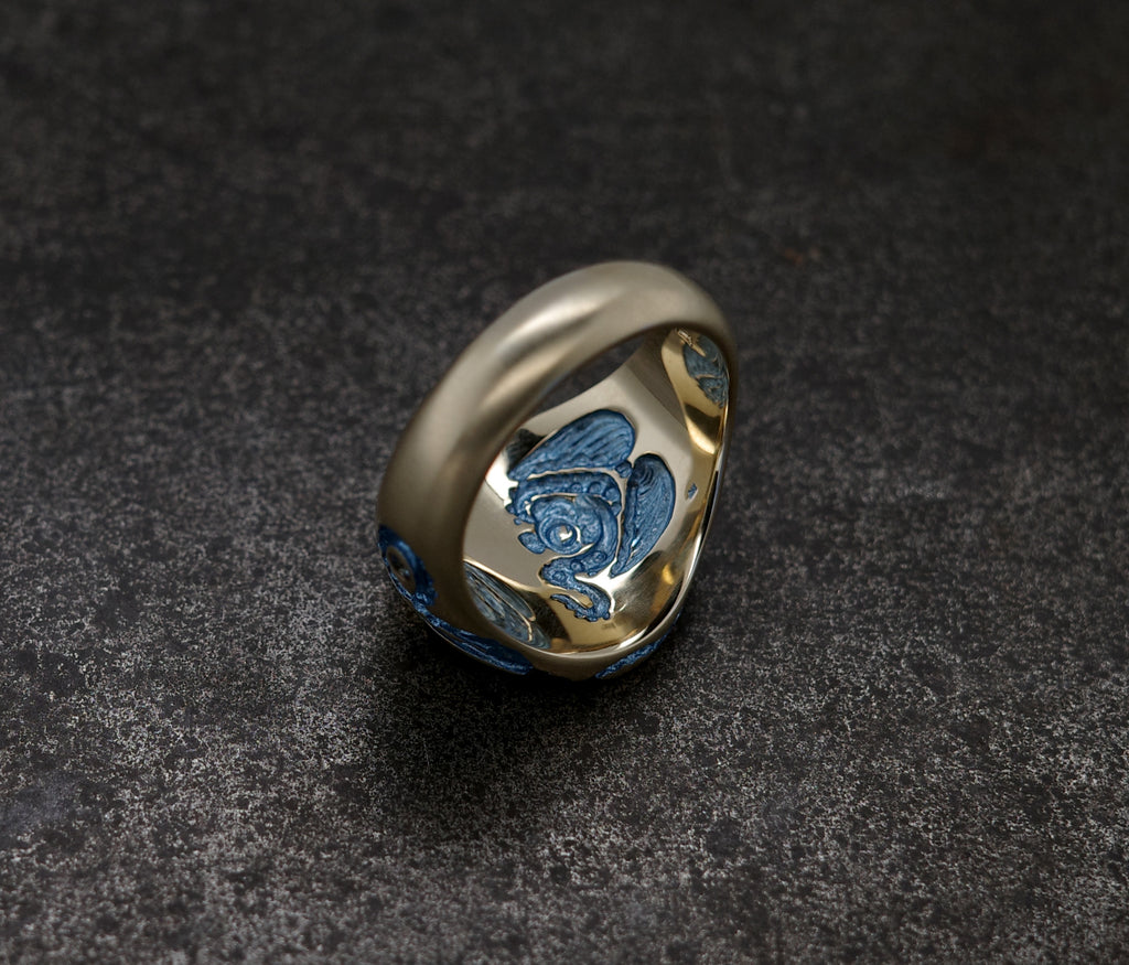 Mini Octopus Signet Ring featuring a hand-engraved octopus design with colorful details.
