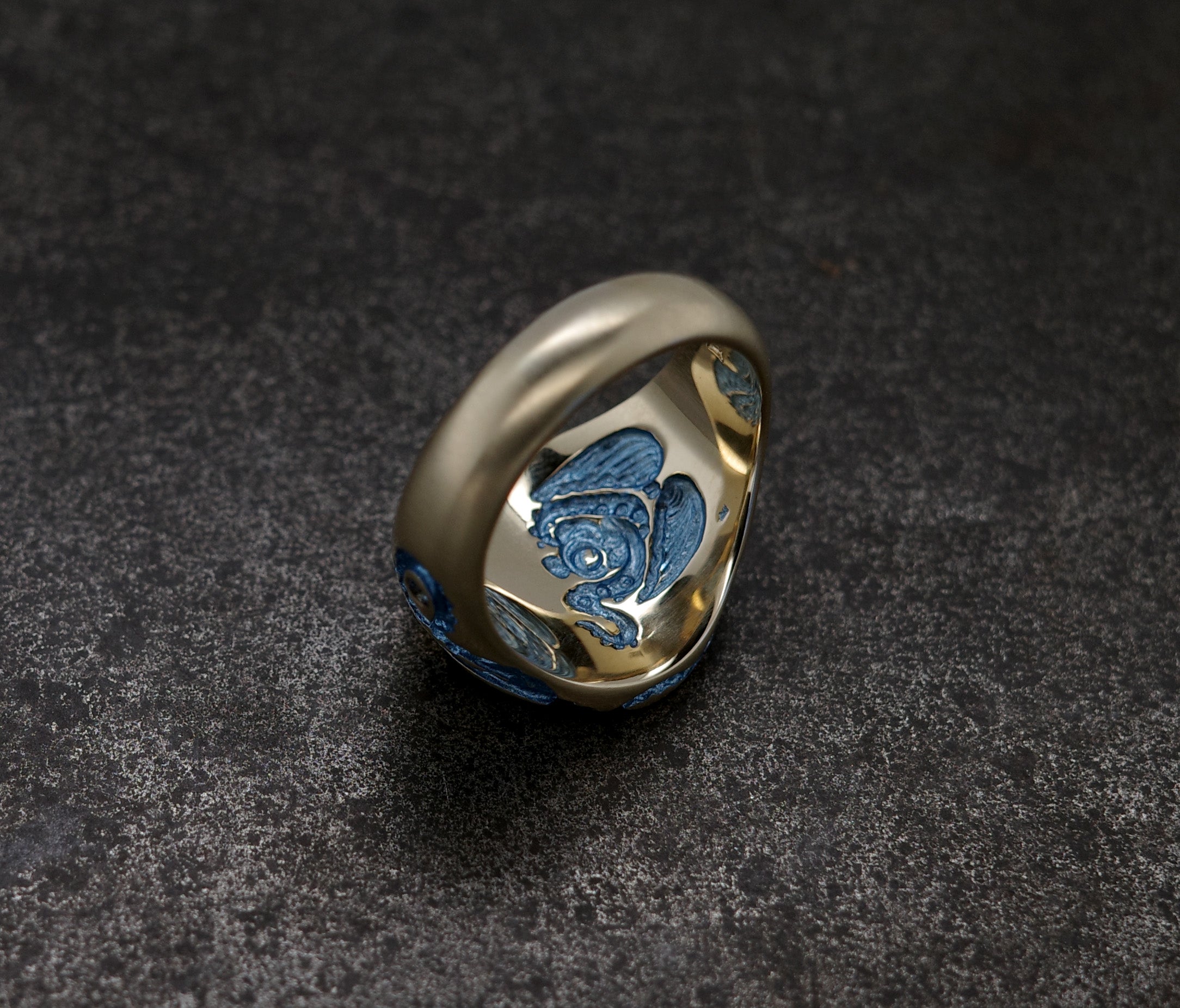 Mini Octopus Signet Ring featuring a hand-engraved octopus design with colorful details.