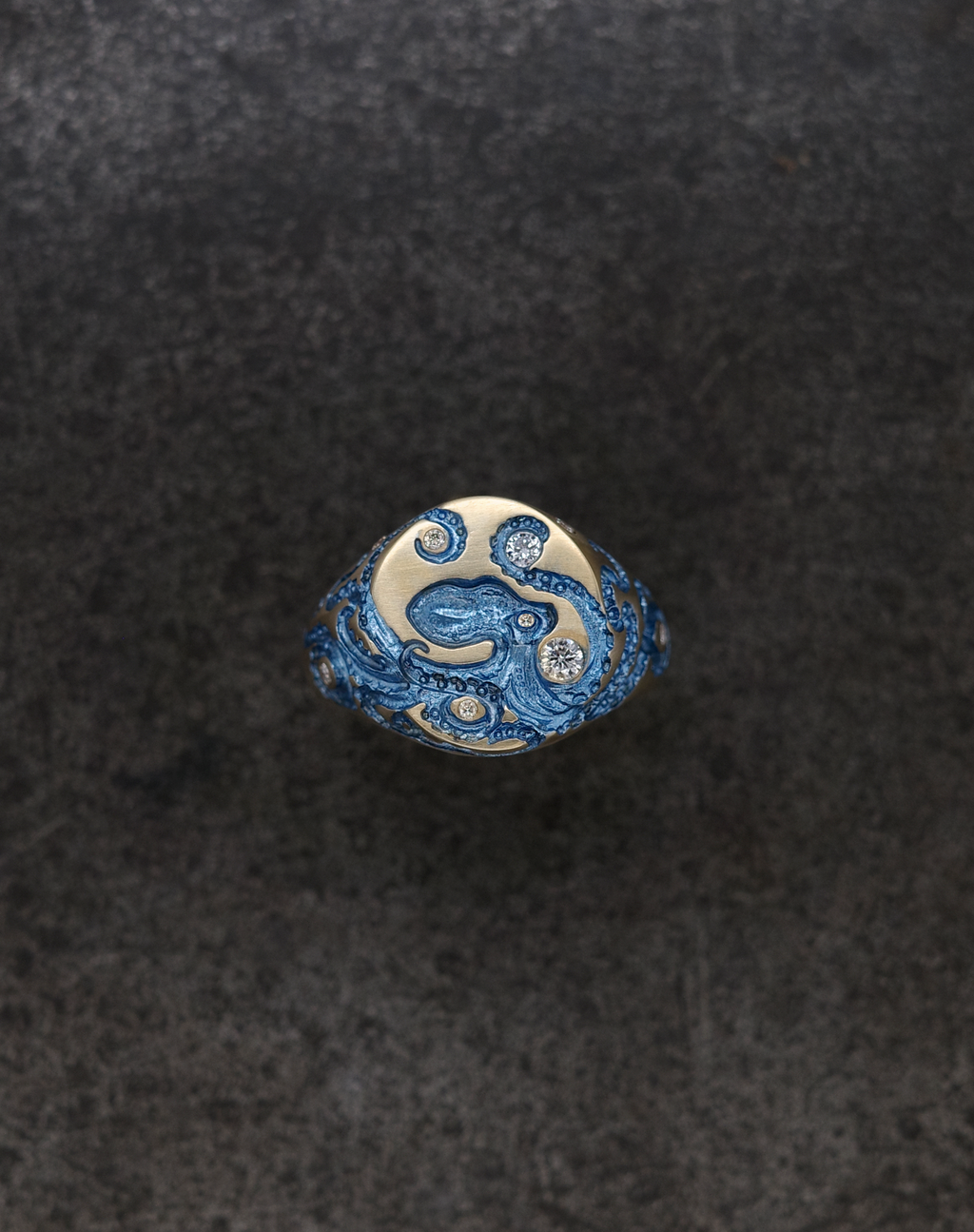 Mini Octopus Signet Ring with intricate octopus design and sparkling gems, showcasing unique craftsmanship.