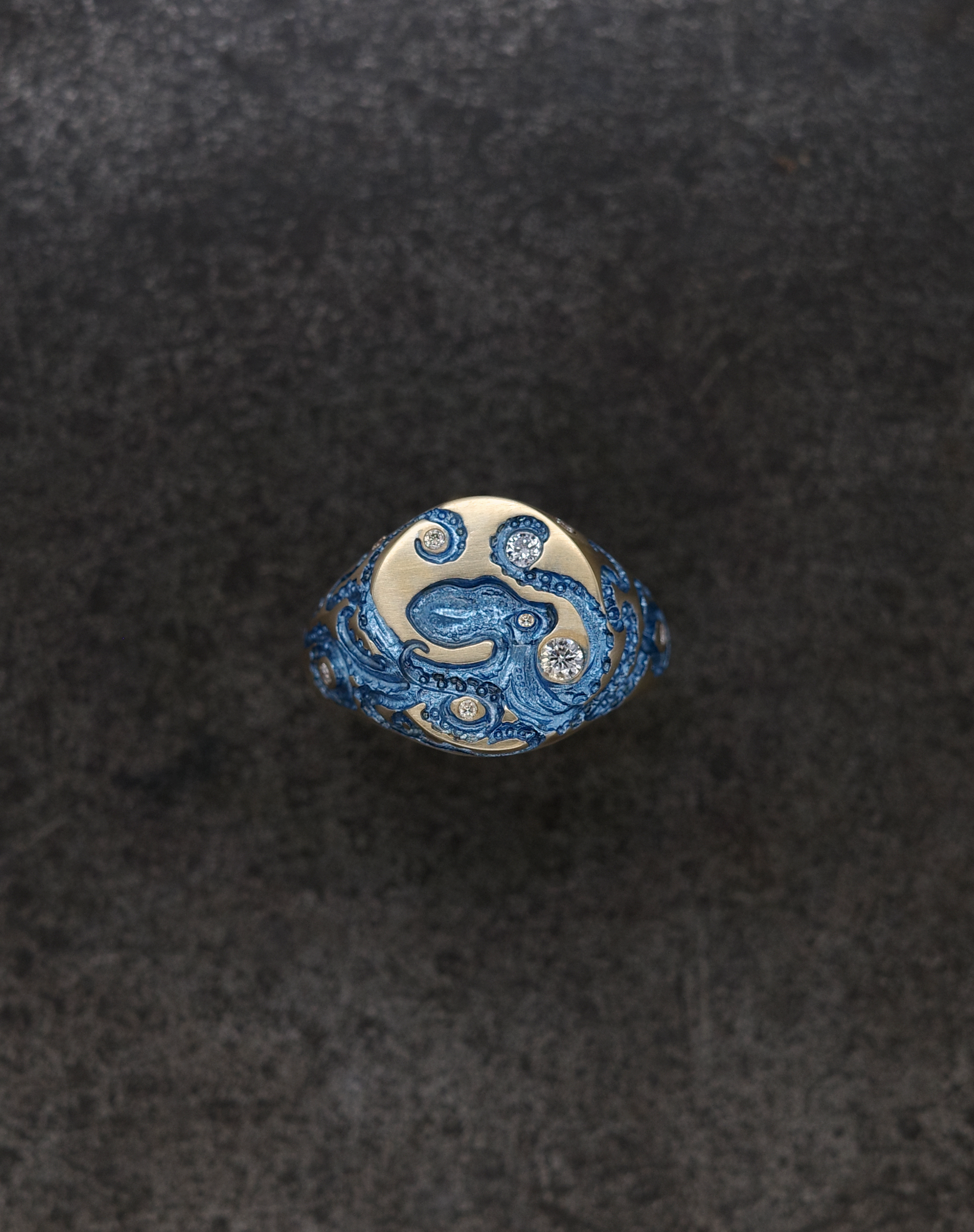 Mini Octopus Signet Ring with intricate octopus design and sparkling gems, showcasing unique craftsmanship.