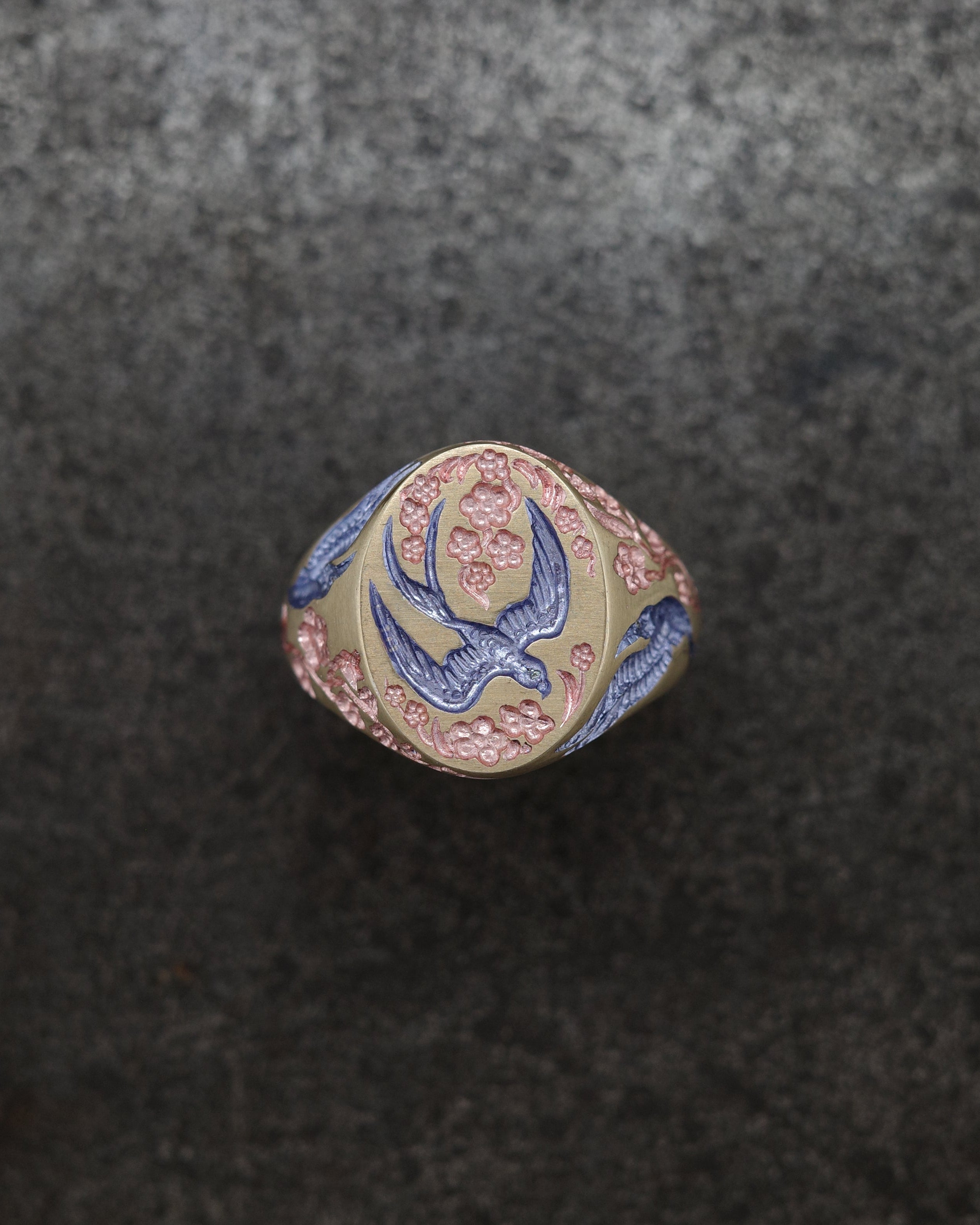 Classic Signet ring with a swooping swallow and flowers 