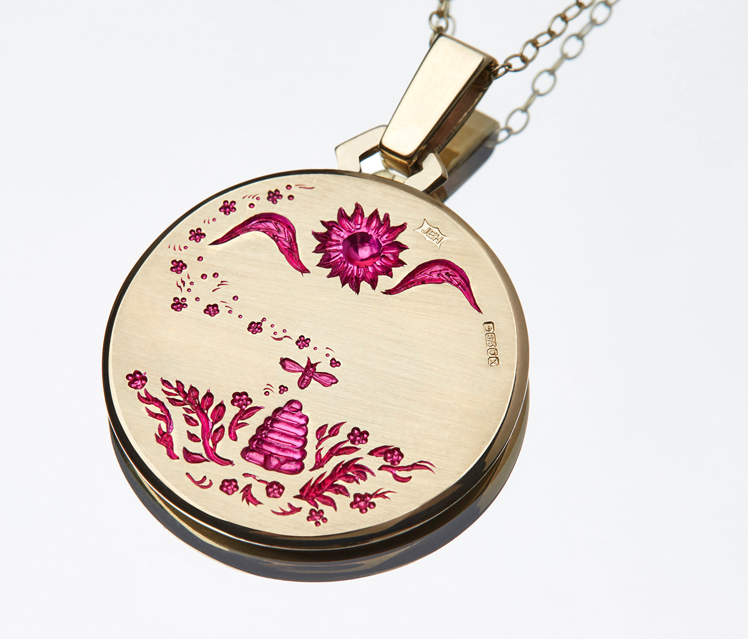 Gold Queen Bee Pendant showing engraved hive, sun, flowers, and butterflies with red enamel details on a chain necklace
