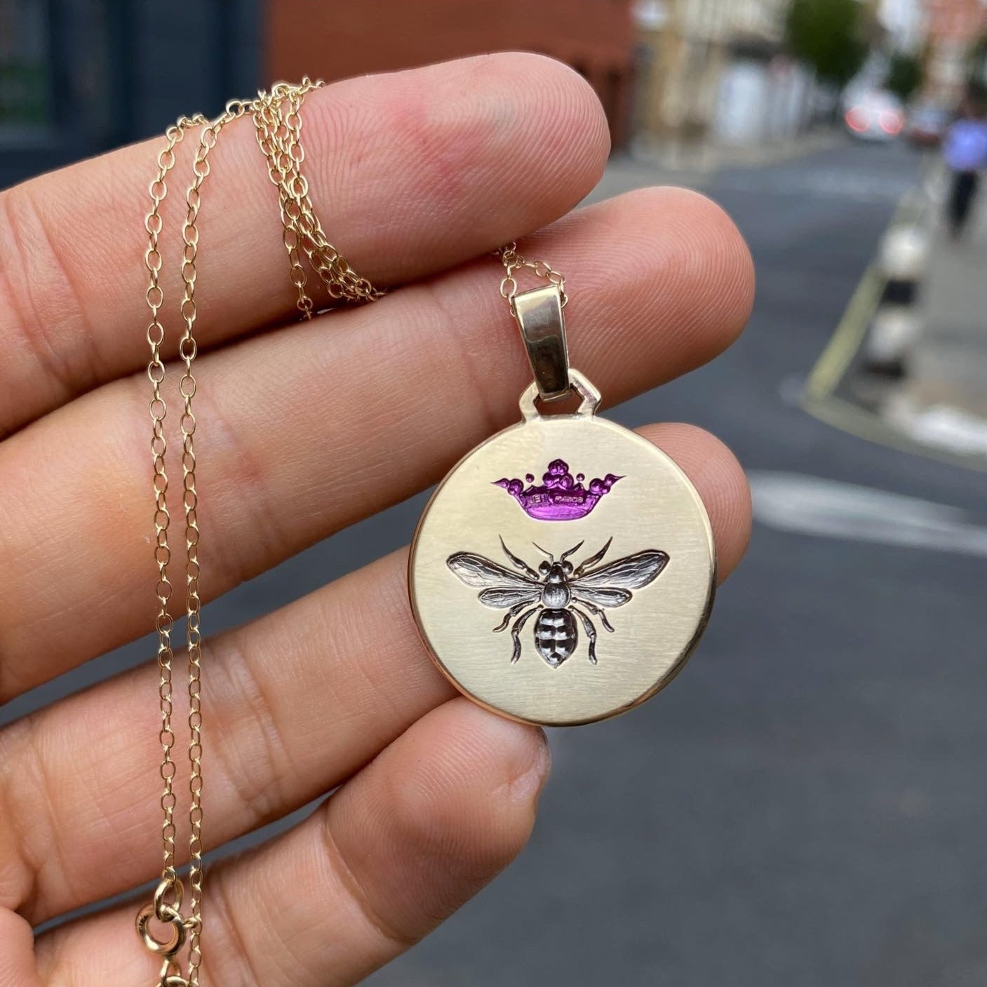Castro Smith Jewelry Gold Queen Bee Pendant Necklace with Purple Engravings.