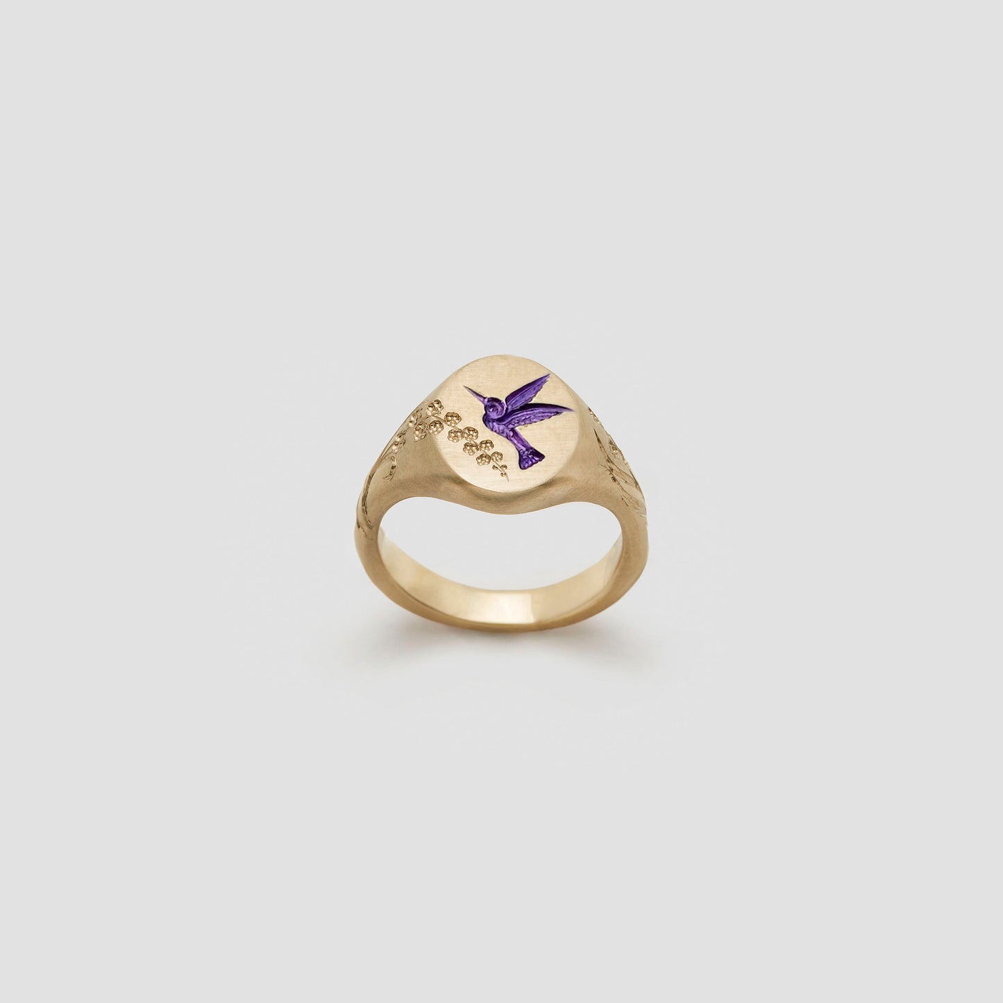 Castro Smith Jewelry Gold Hummingbird Signet Ring with Purple Engravings.