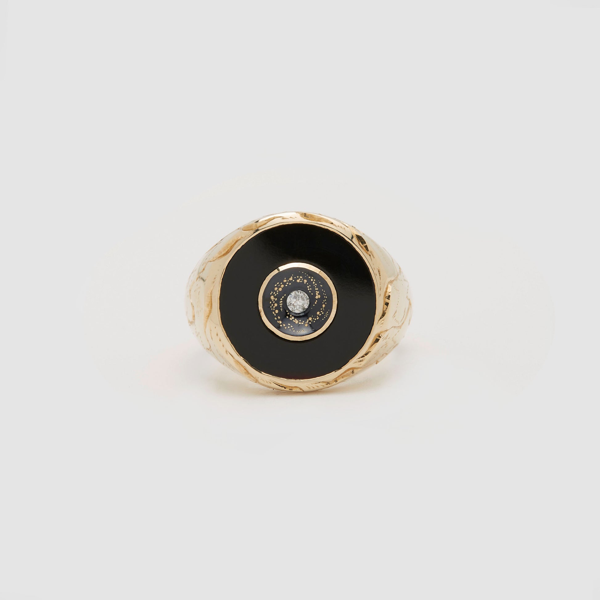Castro Smith Jewelry Gold Oubliette Signet Ring with Onyx Around a Concave Galaxy with a Centre Diamond in Profile View.