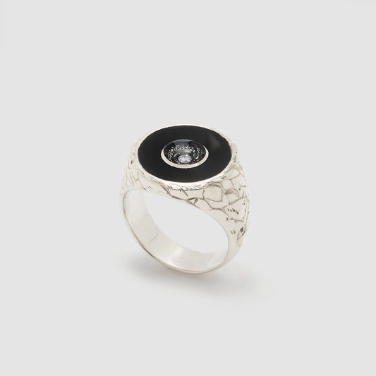 Castro Smith Jewelry Silver Oubliette Signet Ring with Onyx Around a Concave Galaxy with a Centre Diamond.