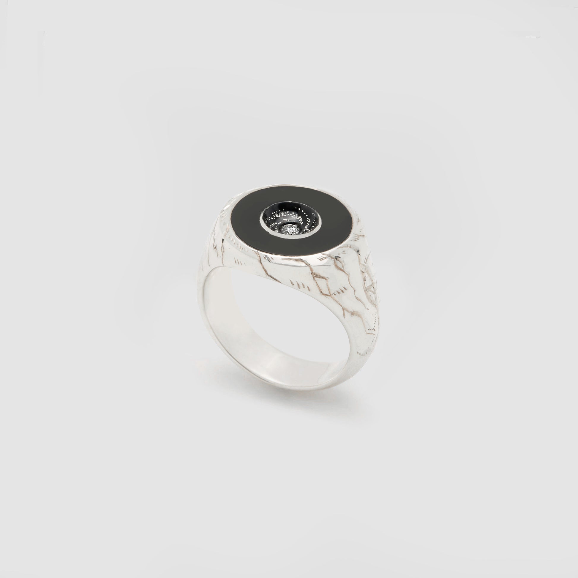 Castro Smith Jewelry Silver Oubliette Signet Ring with Black Onyx Around a Concave Galaxy with a Centre Diamond in Right Side View.