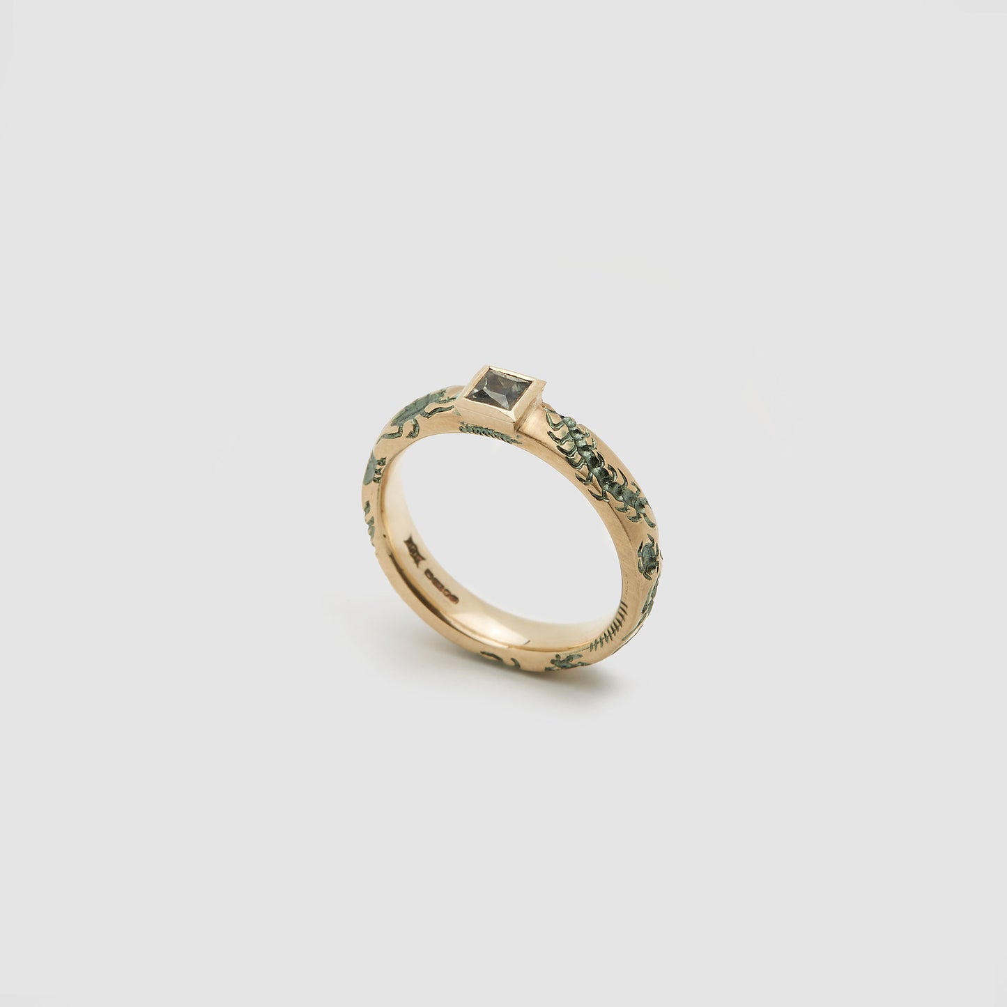 Castro Smith Jewelry Gold Undergrowth Ring with a Square Cut Sapphire and Slate Green Engravings.