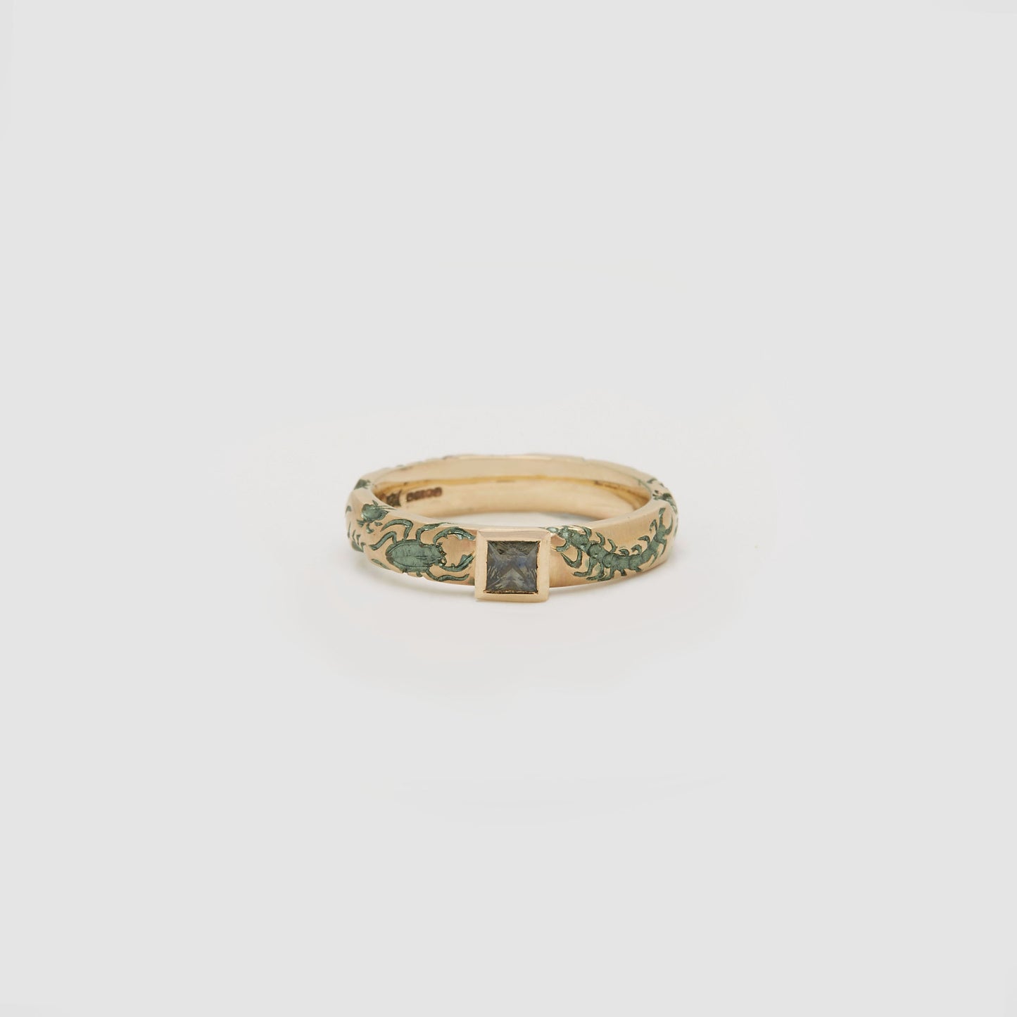 Castro Smith Jewelry Gold Undergrowth Ring with a Square Cut Sapphire and Slate Green Engravings in Profile View.
