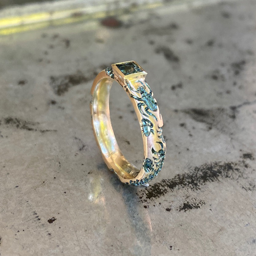 Castro Smith Jewelry Gold Undergrowth Ring with a Square Cut Sapphire and Slate Green Engravings in Side View.